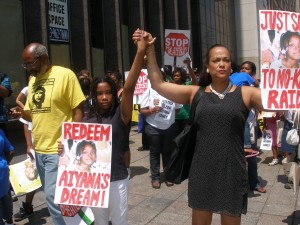Jewel Allison with daughter Honesti at her right lead June 26 protest against Aiyana Jones murder Photo by Herb Boyd