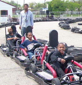 Doll's Go Kart Track owner Ron Hereford, with young customers.